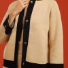 tukan-fondo-beige-borde-negro